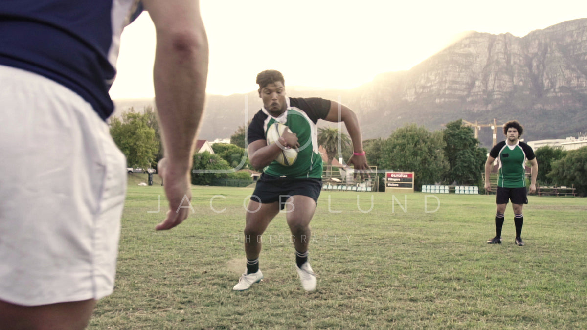Rugby players tackling